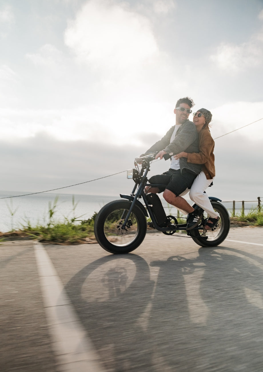 two people riding a 50 rebels r-series large e-bike